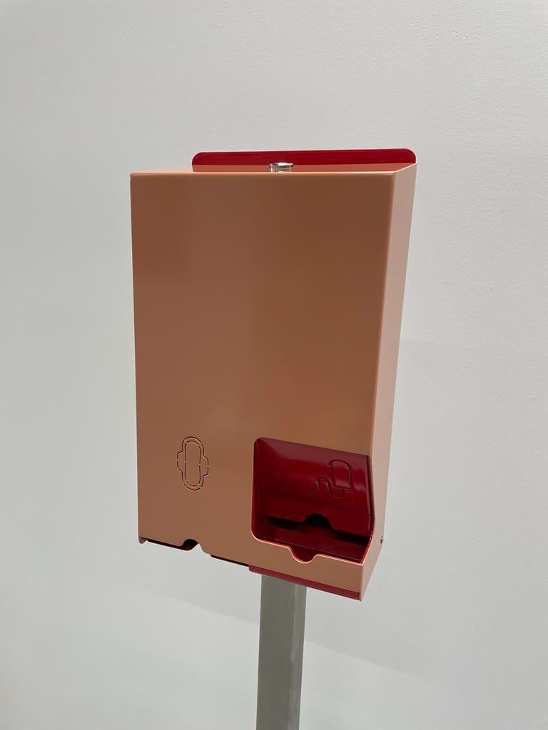 This is an orange feminine product dispenser