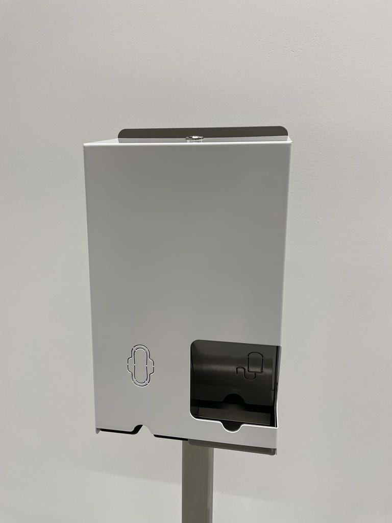 This is a white sanitary napkin dispenser