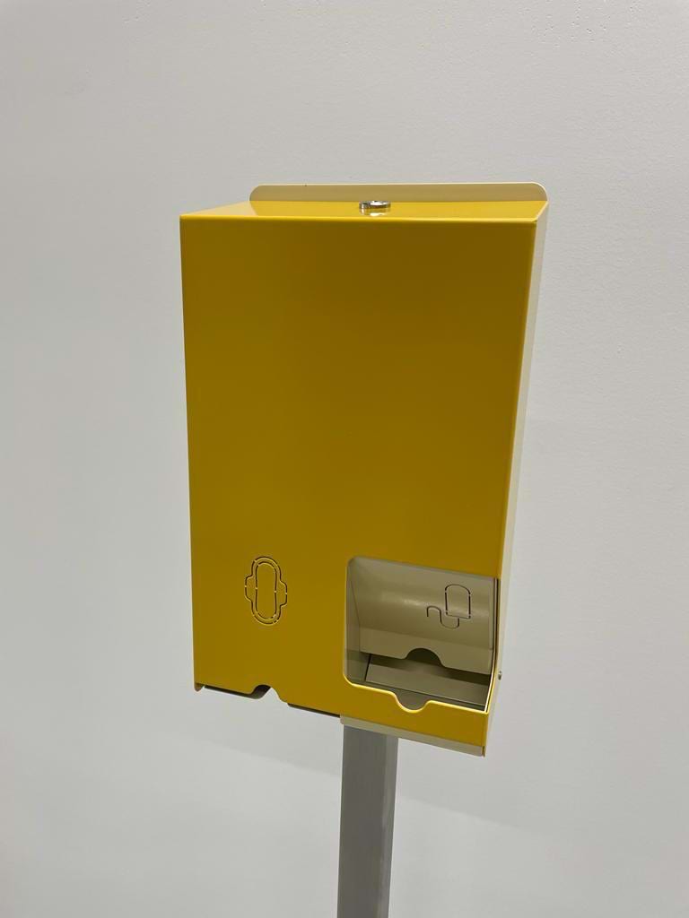 This is a yellow feminine product dispenser