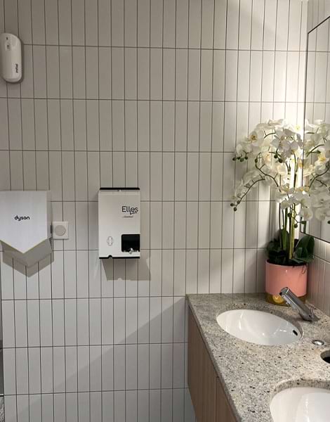 this is a 2 column dispenser in a bathroom